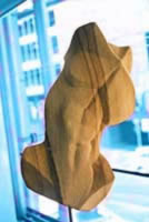 Sculpture of a nude male carved in sandstone entitiled 